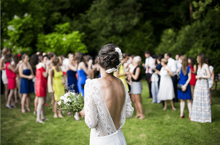 bride throwing flowers